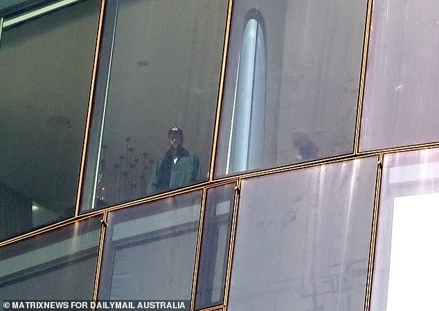 Travis Kelce admires view from his lavish Sydney hotel room after arriving in Australia to join girlfriend Taylor Swift on her Eras tour